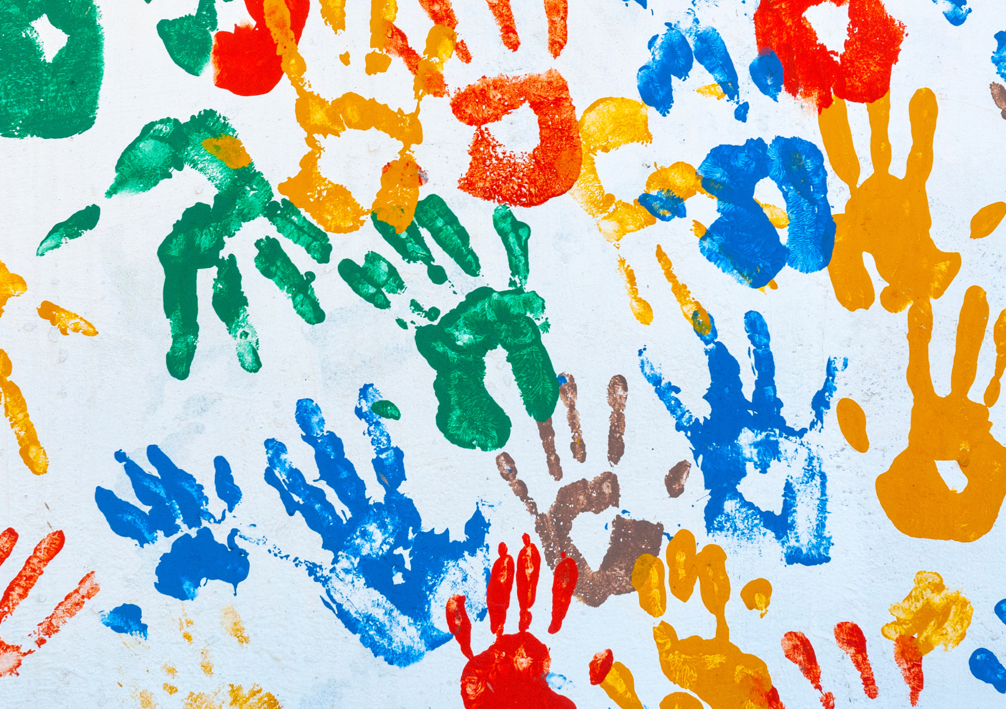 Colourful children's handprints representing creativity and expression